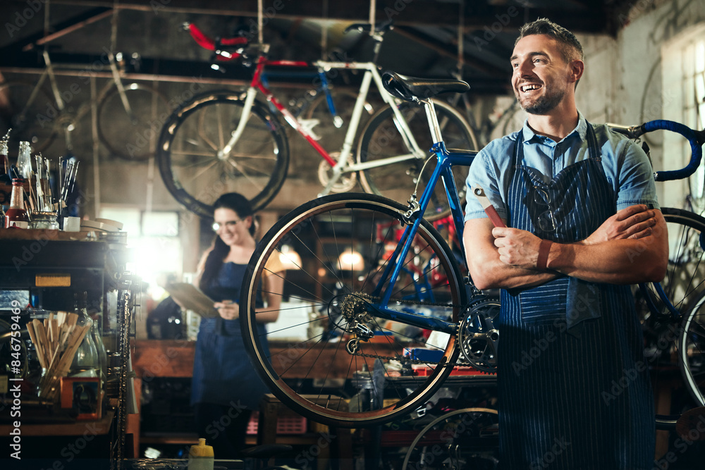 Obraz premium Man, thinking and arms crossed at work in bicycle repair shop or maintenance garage. Bike, mechanic and service with a professional handyman for startup, small business and workshop for fixing