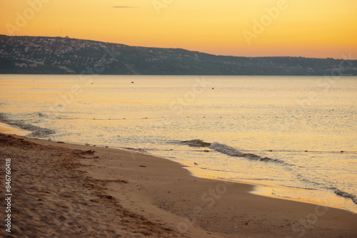 Wallpaper Mural Golden sunrise on serene beach, gentle waves, tranquil shoreline peaceful and picturesque scenery Torontodigital.ca