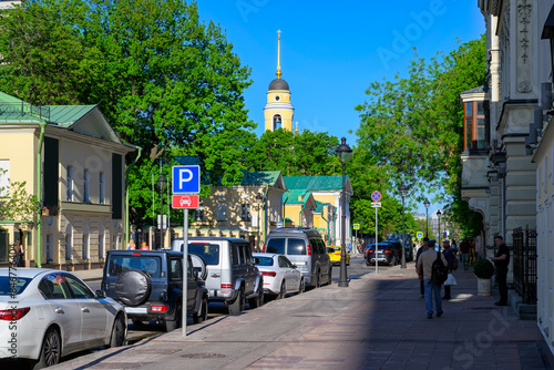 Bolshaya Nikitskaya Street in center of Moscow in Russia. Cozy cityscape in Moscow. Architecture and landmarks of Moscow. photo