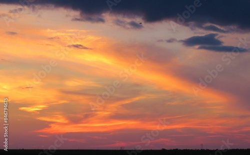 Stunning sunset with vibrant orange and purple hues in the sky.