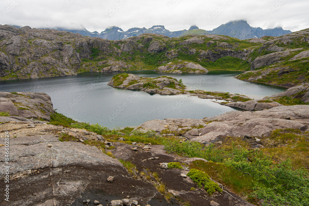 Mountain lakes in Lofoten islands, Nordland, Norway. Hiking in wild nature of Lofoten islands. Mountain lakes in Lofoten islands, Nordland, Norway. Hiking in wild nature of Lofoten islands.