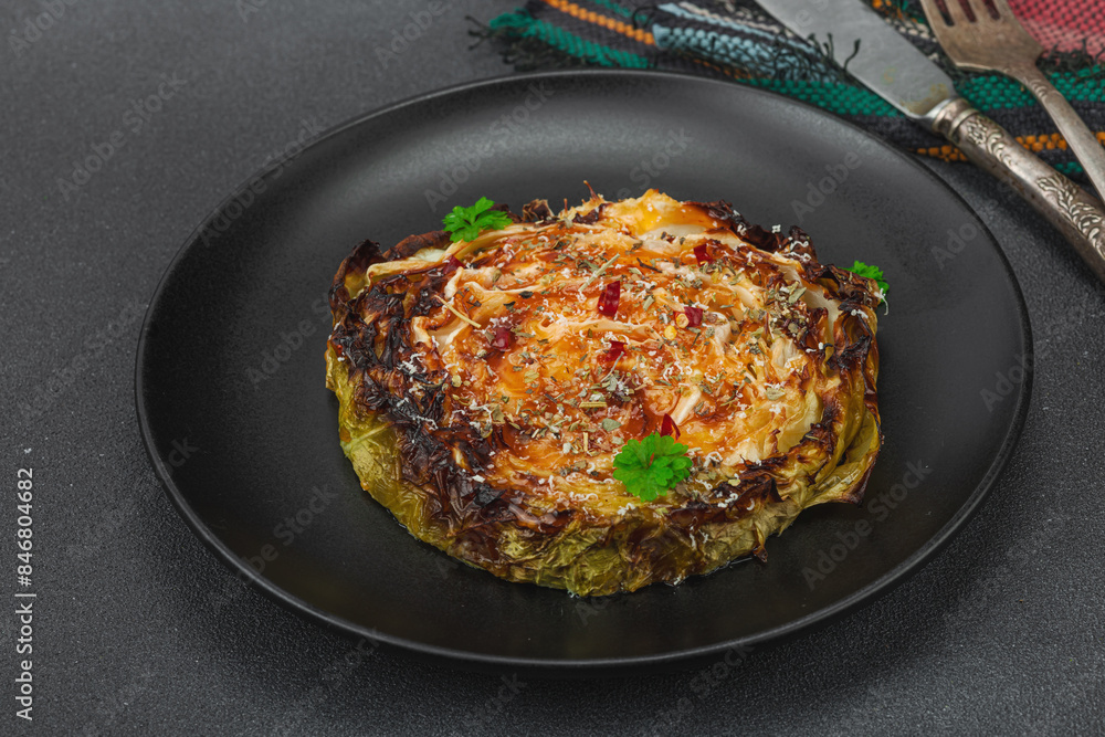 Homemade vegan cabbage steaks with herbs and spices. Healthy food ready to eat on a serving plate Homemade vegan cabbage steaks with herbs and spices. Healthy food ready to eat on a serving plate