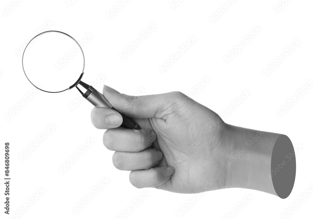 Woman's hand with magnifying glass on white background. Black and white effect Woman's hand with magnifying glass on white background. Black and white effect