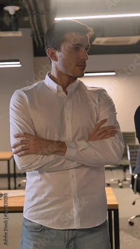 Wallpaper Mural Epic shot of three confident attractive handsome colleagues entrepreneurs. office inside. They turn their head to camera. Super slow motion 150 fps Vertical shot. Torontodigital.ca