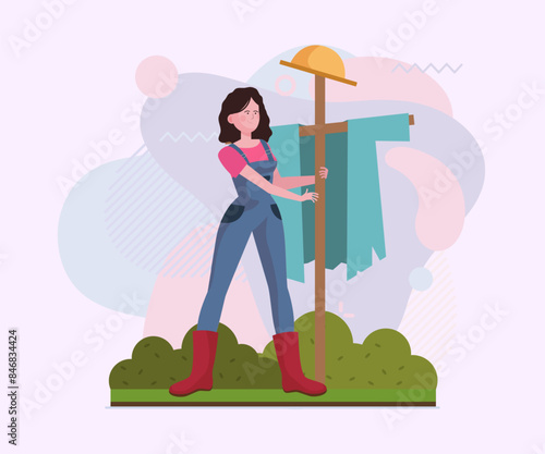 Female gardener setting scarecrow. Woman in overalls and gumboots flat vector illustration. Gardening, farming, activity concept for banner, website design or landing page