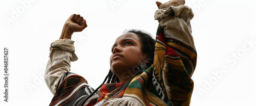 An african woman stands proudly with her arms raised to the sky, militating for her rights