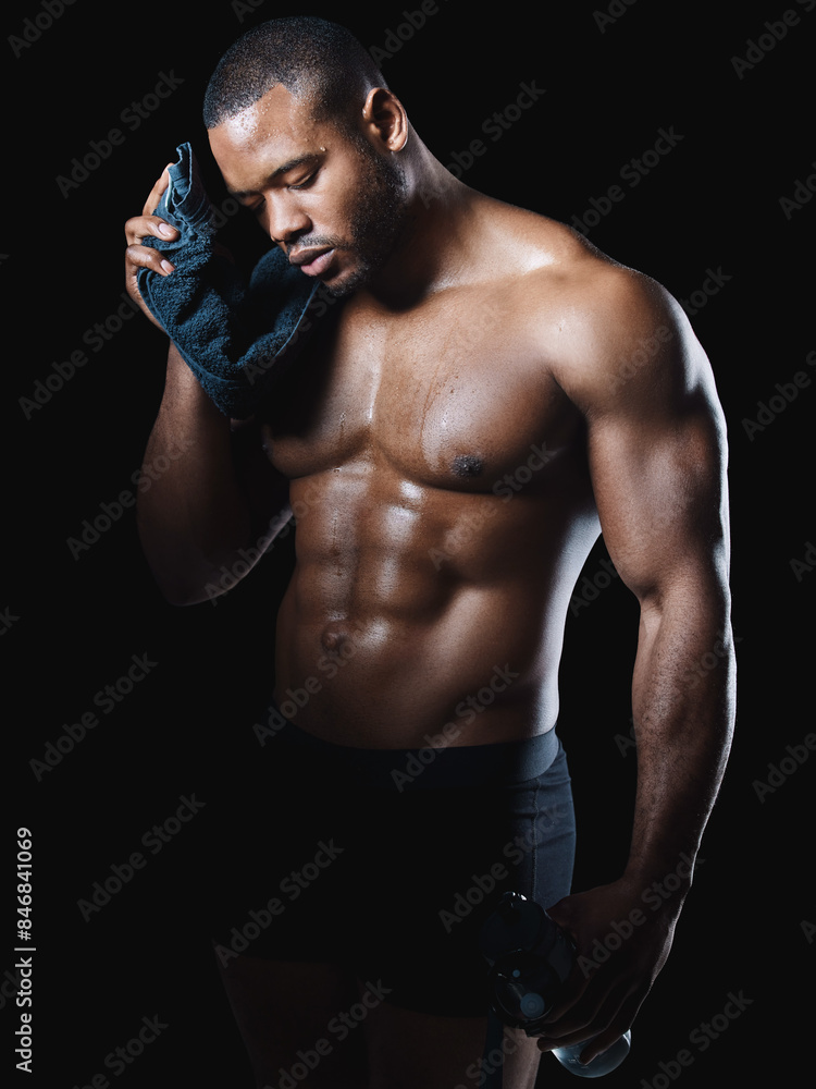 Black man, sweating and towel in studio for fitness, exercise and cleaning or workout. Bodybuilder, wellness and training by dark background for African athlete and shadow on muscles, stomach and abs Black man, sweating and towel in studio for fitness, exercise and cleaning or workout. Bodybuilder, wellness and training by dark background for African athlete and shadow on muscles, stomach and abs