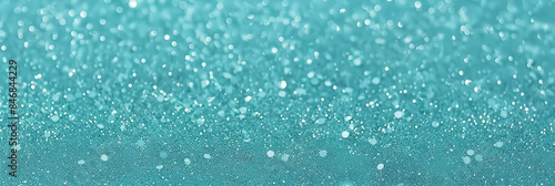 A beautiful turquoise glitter background with sparkling lights and shimmering effects, perfect for festive celebrations, holiday events, and elegant designs..