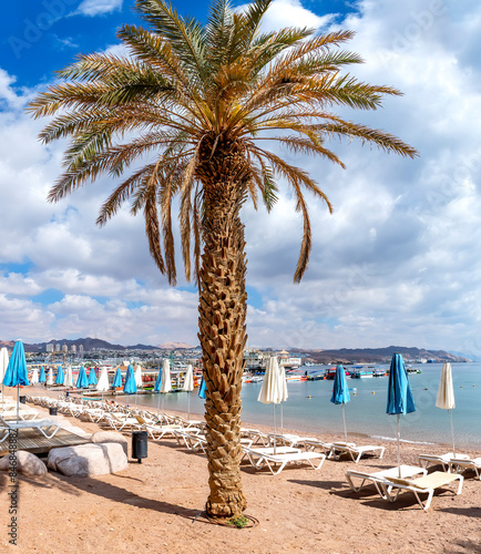 Morning on sandy beach of the Red Sea in Eilat - famous tourist resort and re...
