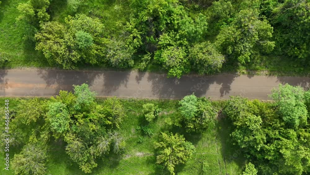 Aerial video over an African road surrounded by bushes and trees. Shai Hills Ghana Aerial video over an African road surrounded by bushes and trees. Shai Hills Ghana