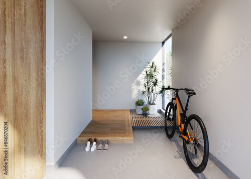 広い土間に自転車が置ける玄関　ホテルライク　観葉植物