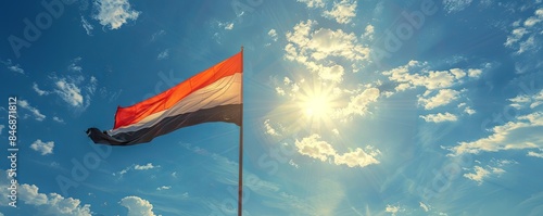 Egypt flag flying against a clear, sunny sky photo