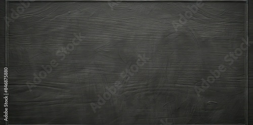chalk board textured background with a pen, ruler, and eraser on a wooden surface photo