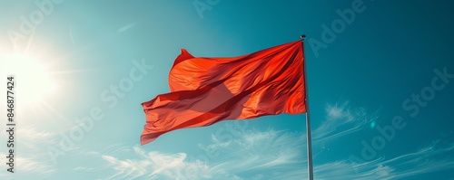 Denmark flag flying against a clear, blue sky