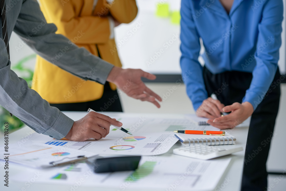 Business meeting with professionals analyzing charts and graphs. Collaborative team discussing data and strategies for growth. Business meeting with professionals analyzing charts and graphs. Collaborative team discussing data and strategies for growth.