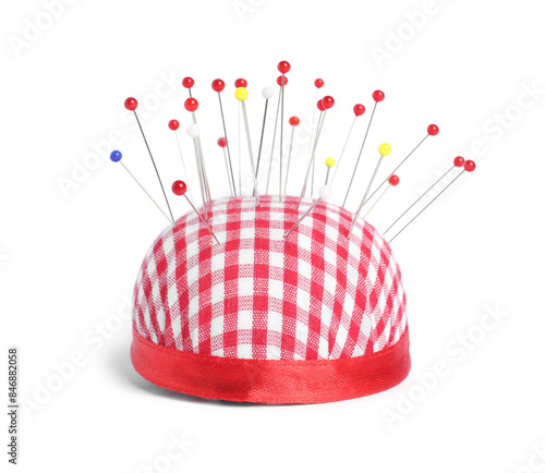 Valokuva Checkered pincushion with sewing pins isolated on white