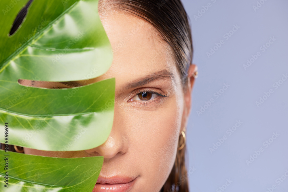 Skincare, portrait and woman with palm leaf in studio for natural beauty, wellness and eco friendly cosmetics on purple background. Dermatology, face and model with monstera, plant or vegan product Skincare, portrait and woman with palm leaf in studio for natural beauty, wellness and eco friendly cosmetics on purple background. Dermatology, face and model with monstera, plant or vegan product