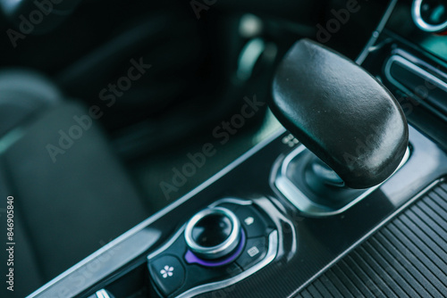 automatic transmission shift selector in the car interior. Closeup a manual shift of modern car gear shifter photo