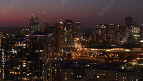 Wallpaper Mural Aerial view of Nashville at dusk, showcasing the city lights, glowing skyscrapers and construction cranes against the twilight sky Torontodigital.ca