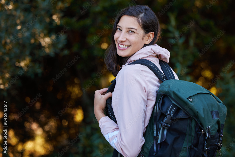 Hiking, portrait and happy woman with backpack in forest for adventure, explore and trekking journey in nature. Park, face and girl camper smile in woods for freedom, travel and campsite discovery Hiking, portrait and happy woman with backpack in forest for adventure, explore and trekking journey in nature. Park, face and girl camper smile in woods for freedom, travel and campsite discovery