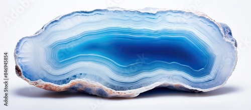 Close-up of a translucent blue agate crystal isolated on a white background, ideal for interior decoration. with copy space image. Place for adding text or design