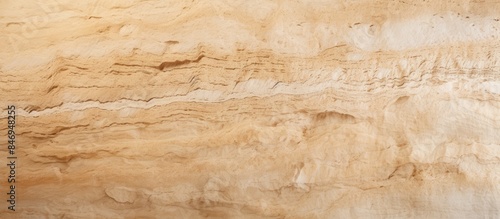 A striking sandstone wall displaying a distinct brown and white rock design adds natural beauty to the surroundings. with copy space image. Place for adding text or design