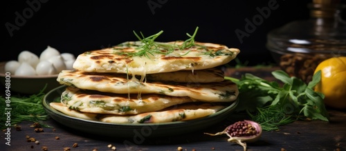 Assorted food items like flatbreads, herbs, and cheese showcased up close on a plate. with copy space image. Place for adding text or design