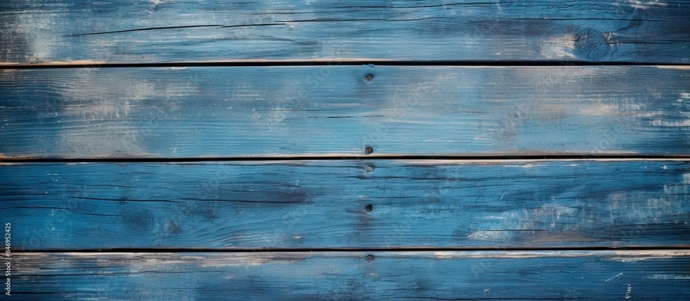 Close-up view of a weathered blue wooden wall surface showing signs of age and wear. with copy space image. Place for adding text or design Close-up view of a weathered blue wooden wall surface showing signs of age and wear. with copy space image. Place for adding text or design