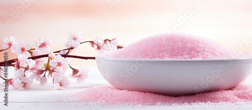 Pink sugar in a bowl placed...