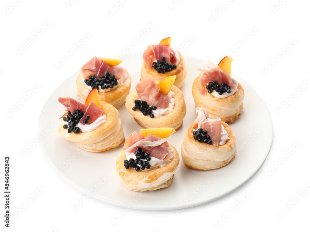 Delicious puff pastry with cream cheese, ham, black caviar and peach isolated on white Delicious puff pastry with cream cheese, ham, black caviar and peach isolated on white
