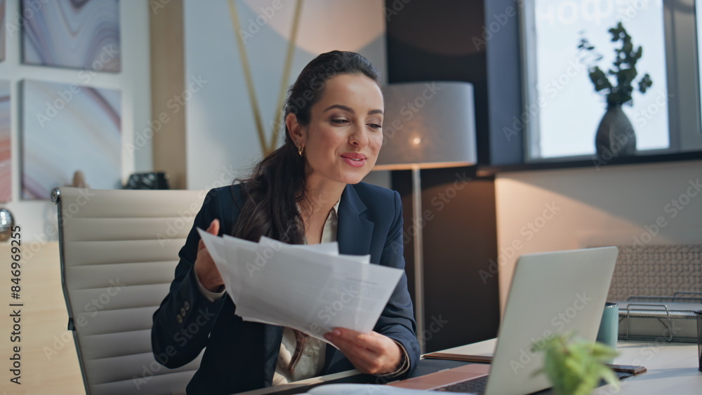 Happy woman greeting video waving hand at office using laptop camera closeup Happy woman greeting video waving hand at office using laptop camera closeup