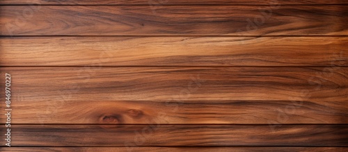 Close-up of teak wood grain displaying a deep brown stain on the surface, showcasing natural wood patterns. with copy space image. Place for adding text or design