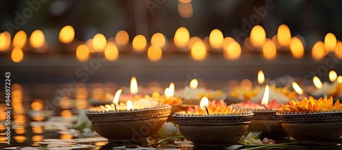 Row of lit candles on a tab...