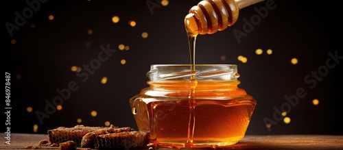 Pouring organic honey into ...