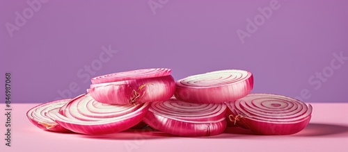 Slices of red onion arrange...