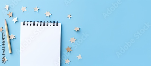 White notebook with pen and...