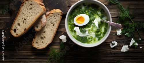 Serving of green borscht wi...
