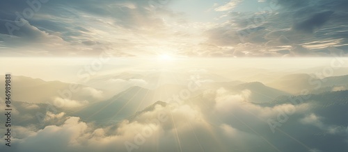 Mountain range under sunbea...
