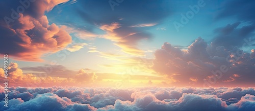 Captivating view of a sunset above the clouds from a plane, with stunning fluffy thunderstorm clouds and dark thunderclouds creating a dramatic weather backdrop. with copy space image