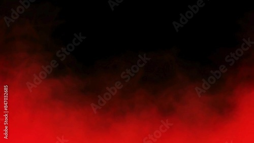 Abstract red smoke or fog slowly moving on black background