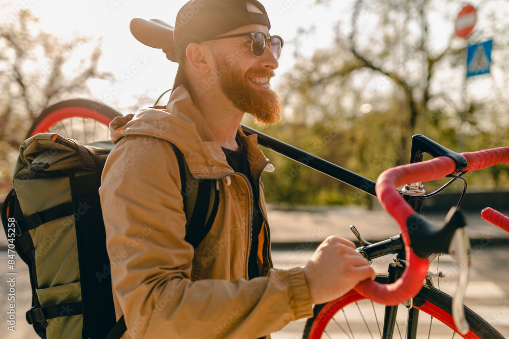 handsome bearded man traveling with bicycle in morning handsome bearded man traveling with bicycle in morning