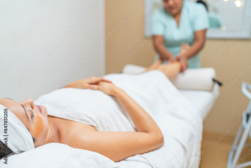 Woman receiving beauty treatment and massage in spa Woman receiving beauty treatment and massage in spa