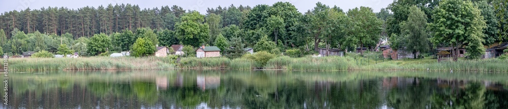 old poor village houses on lake side. Panorama landscape old poor village houses on lake side. Panorama landscape