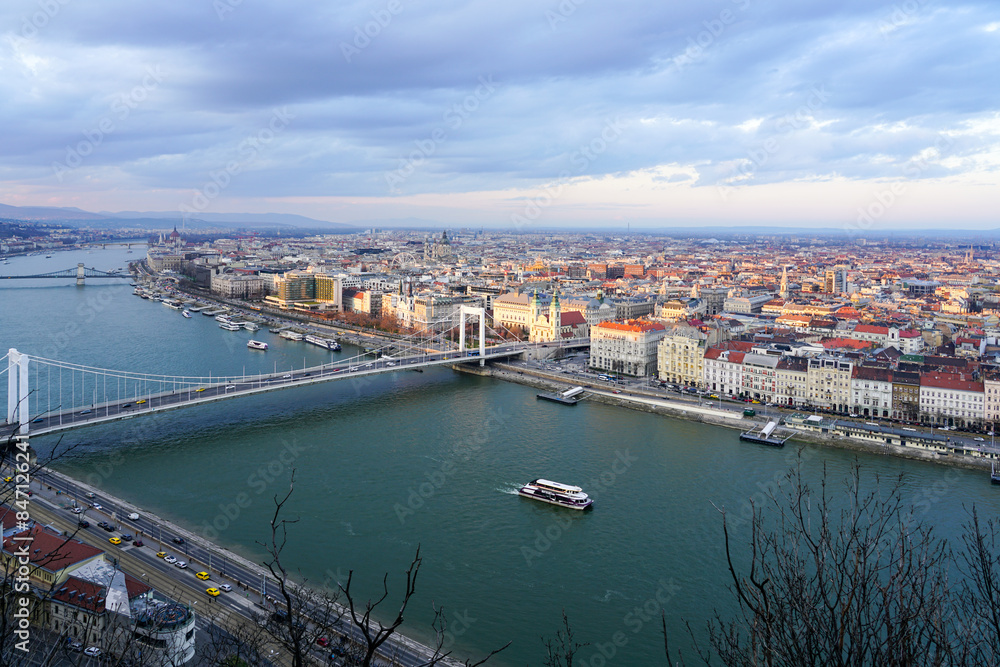 Fototapeta premium Beautiful view of the city of Budapest with Danube river with bridges from Gellert Hill cloudy sky