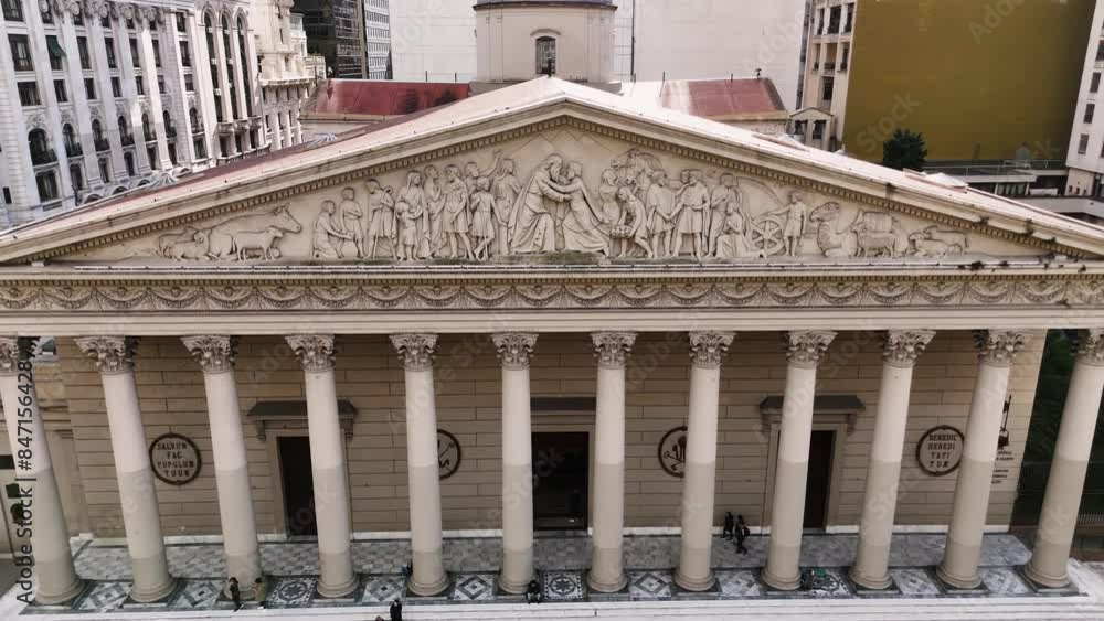 Facade of the Metropolitan Cathedral of Buenos Aires. Aerial camera moving back from pediment engravings towards Plaza de Mayo Facade of the Metropolitan Cathedral of Buenos Aires. Aerial camera moving back from pediment engravings towards Plaza de Mayo