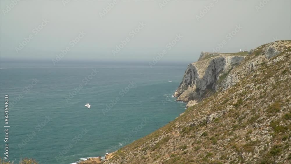 Slow motion, aerial view of a coastline with cliffs, in Javea, Alicante (Spain) Slow motion, aerial view of a coastline with cliffs, in Javea, Alicante (Spain)