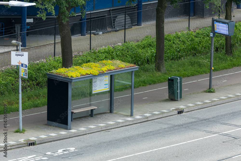 Modern bus stop with roof garden and Bus Stop sign with LED Display destination Utrecht Central Station. Modern bus stop with roof garden and Bus Stop sign with LED Display destination Utrecht Central Station.