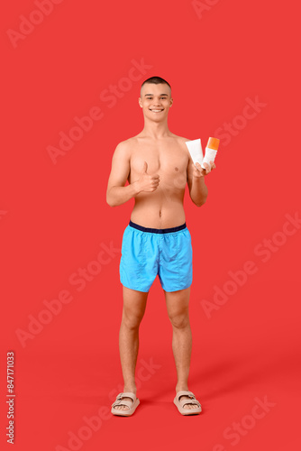 Happy young man with bottle...