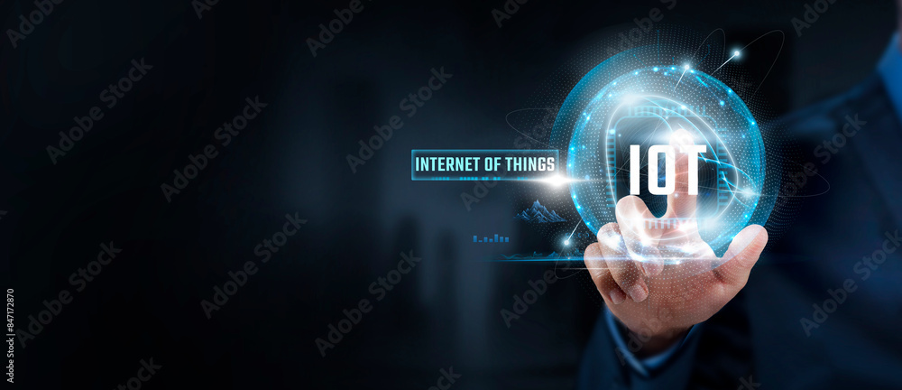 Fototapeta premium IoT Innovation, Connectivity: Businessman Touching Internet of Things (IoT) Icon and Global Network. Smart Devices, Automation.