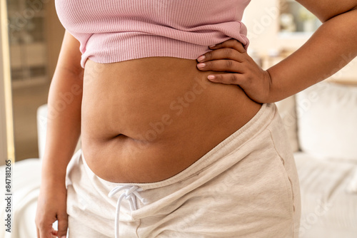 Close-up of Woman Touching Her Waist photo